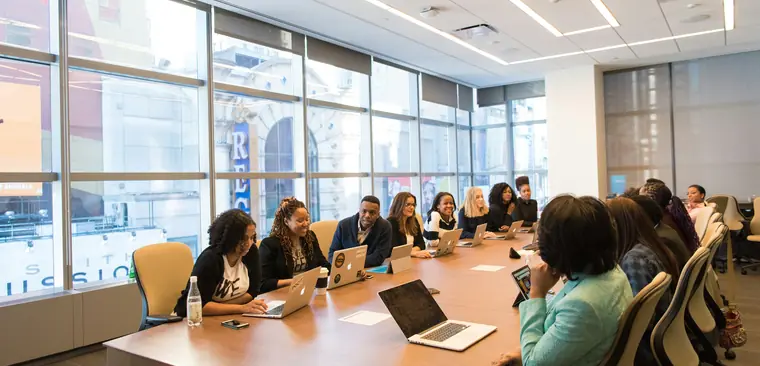 A team meeting around a boardroom table